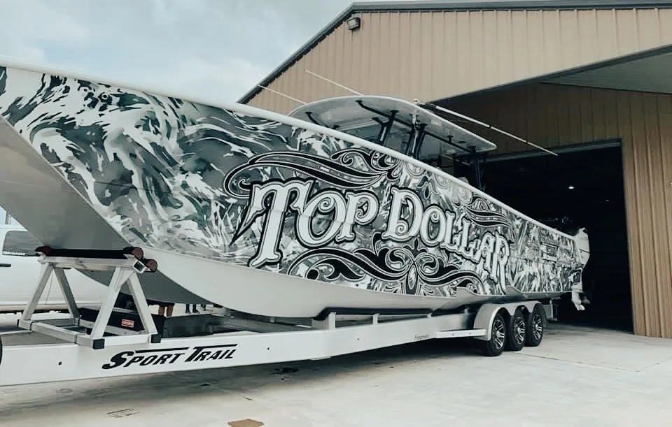 Custom marine wrap on a boat hull finished by The Wrap Guys