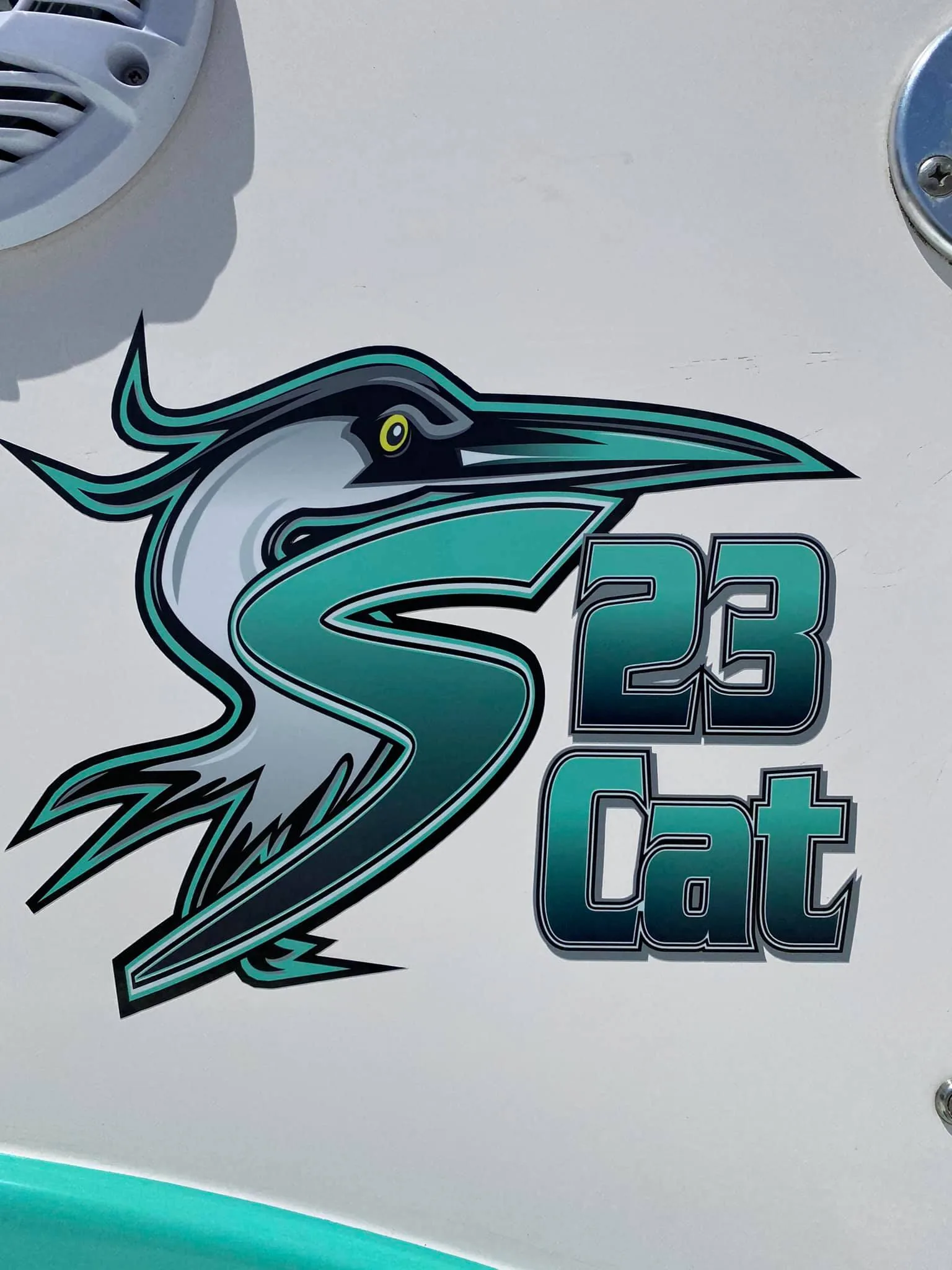 Cut vinyl logo and hull number on a boat console