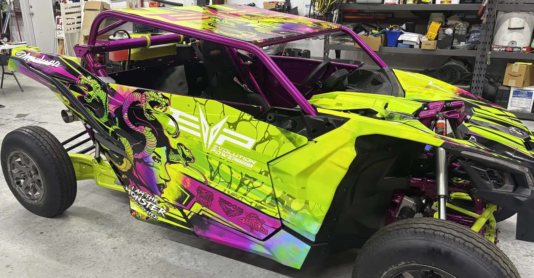 Neon green and magenta UTV wrap with custom snake artwork